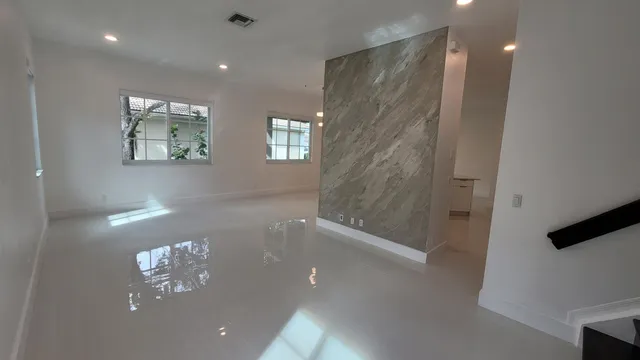 a view of a hallway with windows