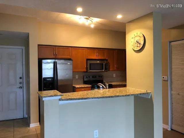 a view of living room with furniture and a flat screen tv