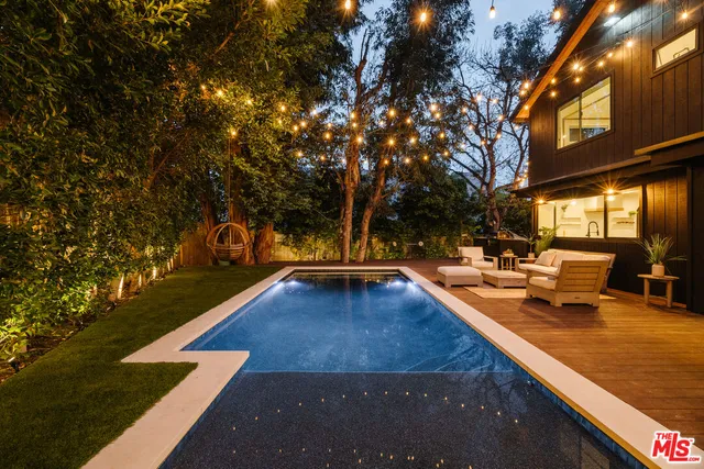 a view of swimming pool with chairs