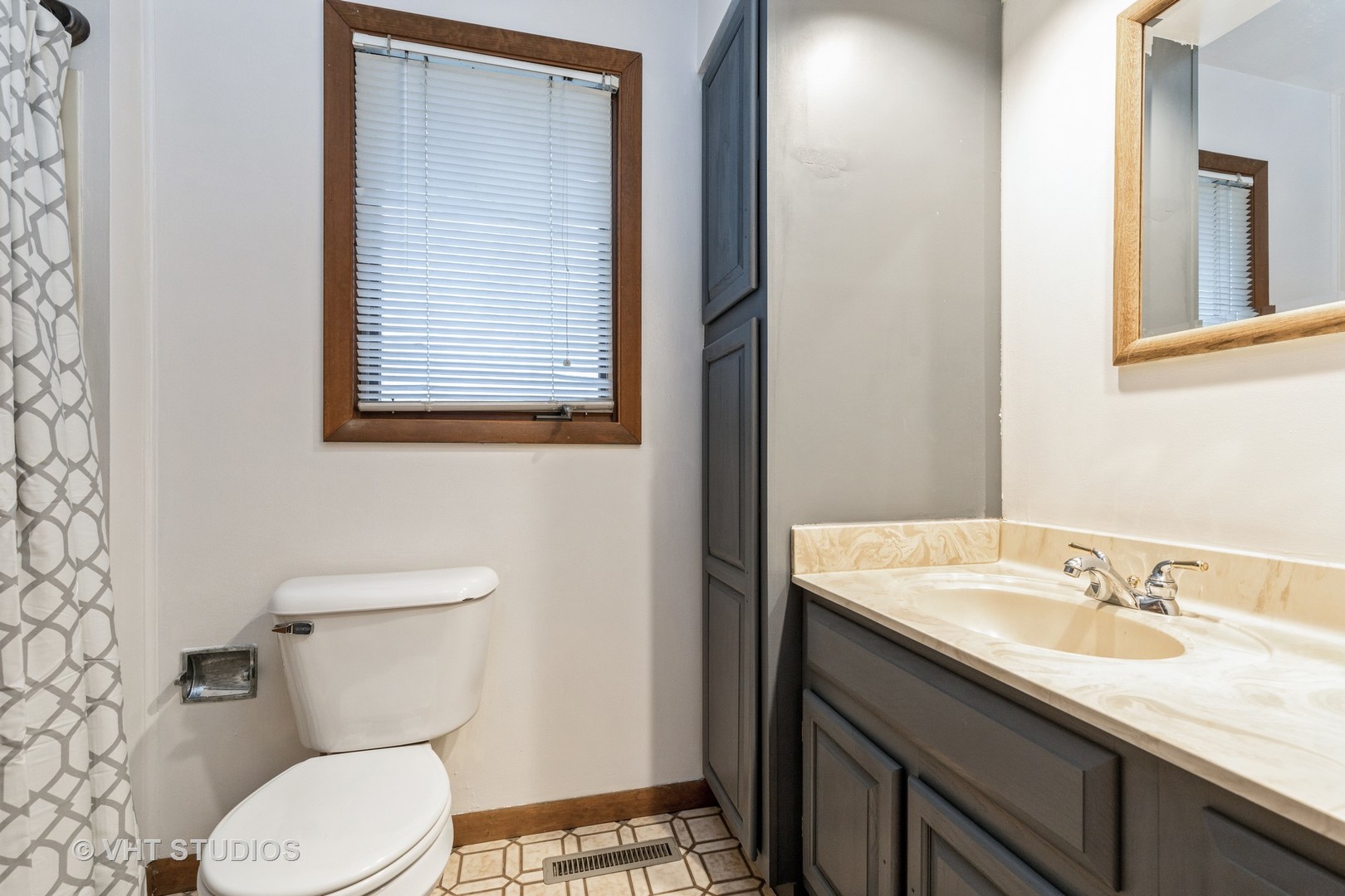 103 Beach Drive Algonquin, IL 60102 - Photo 17 of 21 a bathroom with a granite countertop toilet sink and mirror