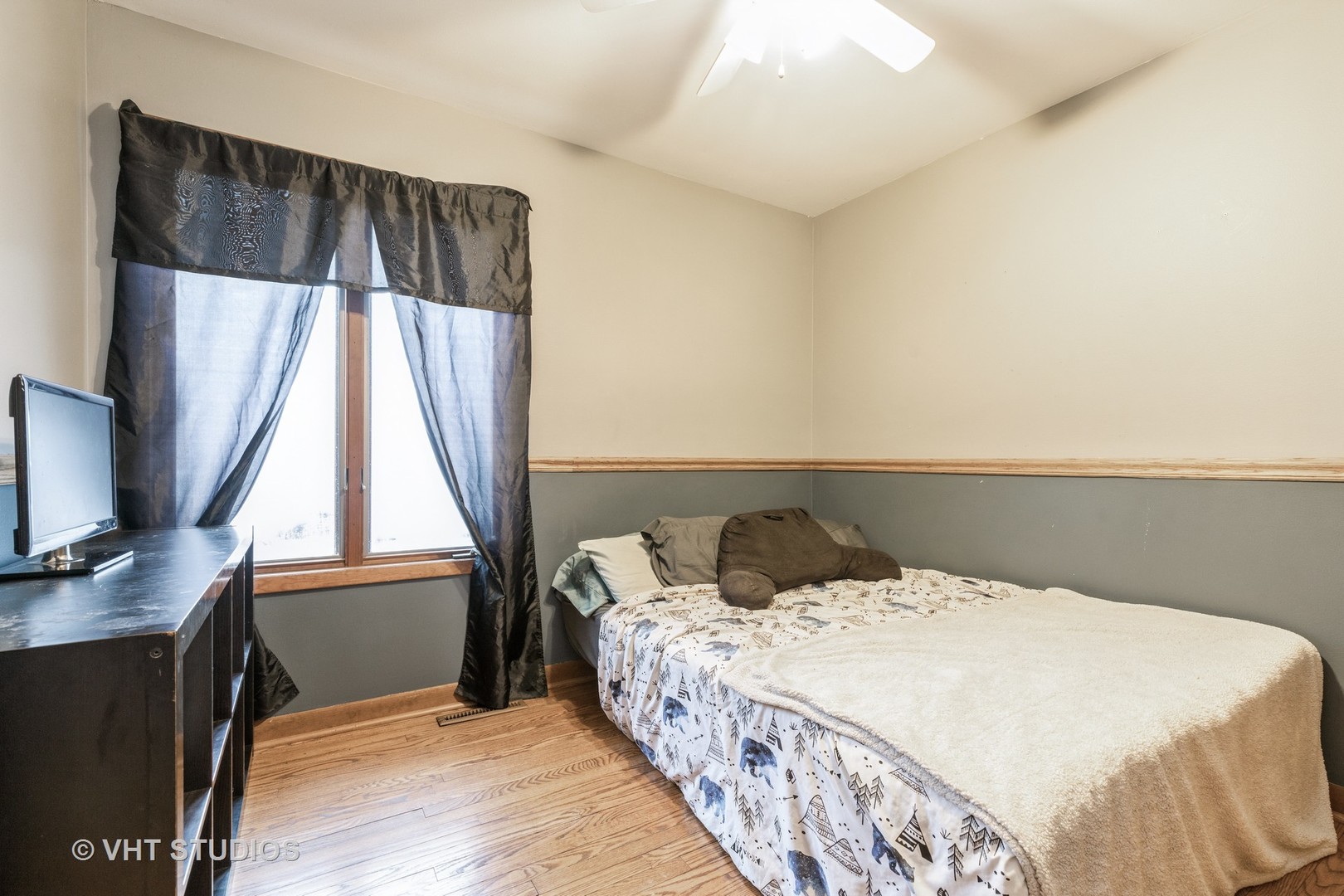 103 Beach Drive Algonquin, IL 60102 - Photo 18 of 21 a bedroom with a bed and a flat tv screen on a dresser