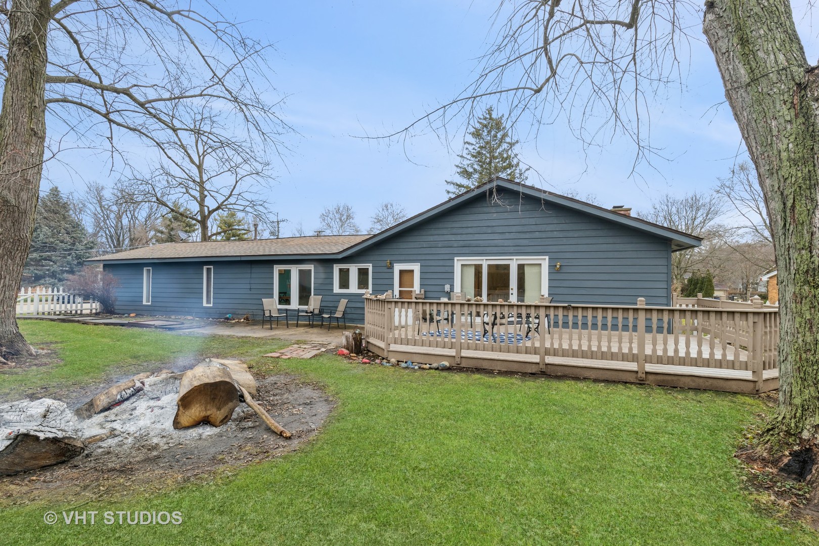 103 Beach Drive Algonquin, IL 60102 - Photo 5 of 21 a front view of a house with a yard table and chairs