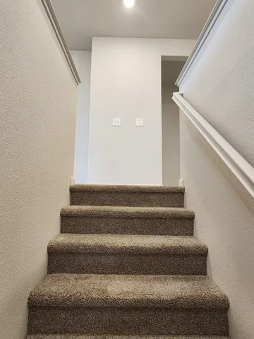 an empty room with a empty space and windows