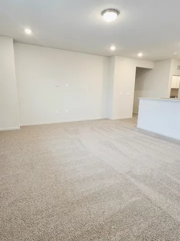 a spacious bathroom with a double vanity sink toilet and a mirror