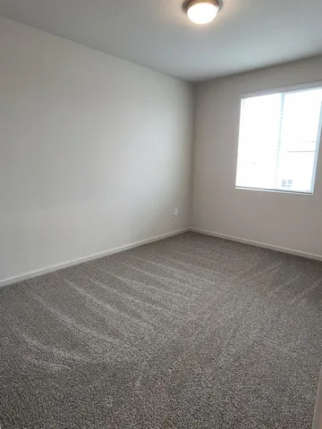 a spacious bathroom with double sink and a mirror