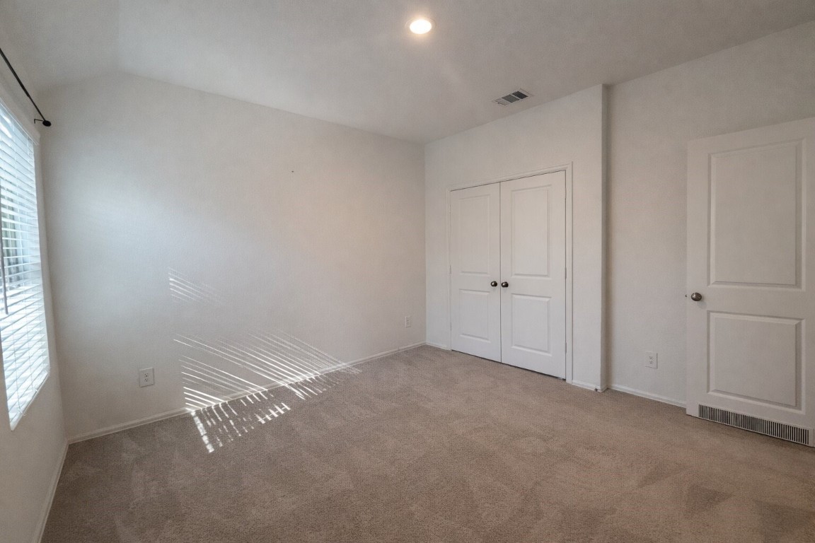 3105 Catalonion Court Conroe, TX 77301 - Photo 13 of 16 an empty room with windows
