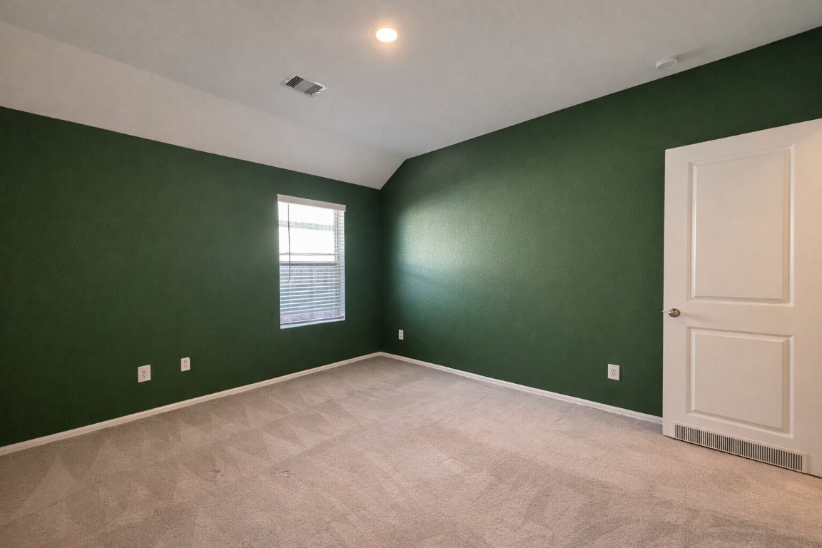 3105 Catalonion Court Conroe, TX 77301 - Photo 14 of 16 an empty room with windows and closet