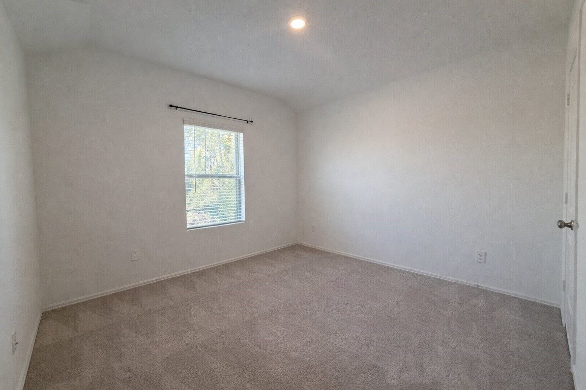 3105 Catalonion Court Conroe, TX 77301 - Photo 16 of 16 an empty room with a window