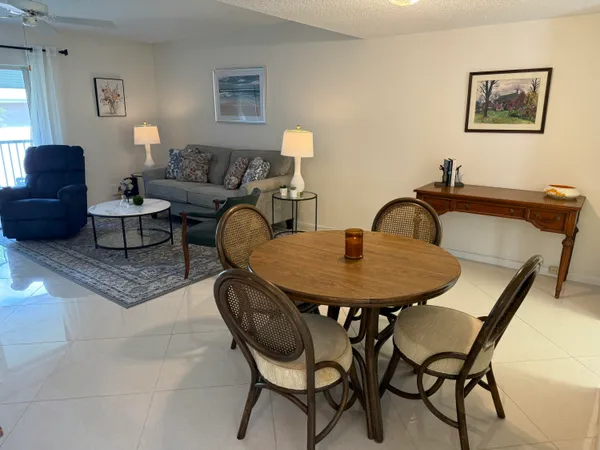 a view of a livingroom with furniture and window