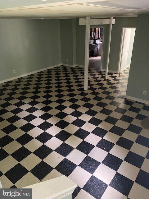 9290 Windrush Drive Lorton, VA 22079 - Photo 14 of 15 a room with a black white checkered floor