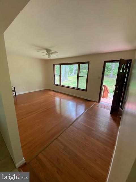 9290 Windrush Drive Lorton, VA 22079 - Photo 3 of 15 wooden floor in an empty room with a window