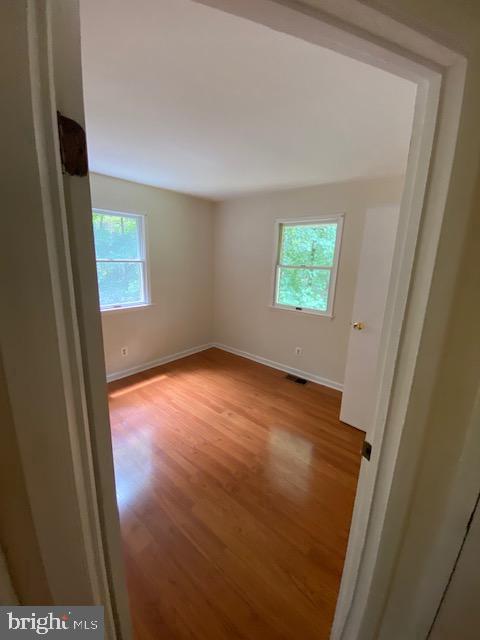 9290 Windrush Drive Lorton, VA 22079 - Photo 10 of 15 an empty room with windows