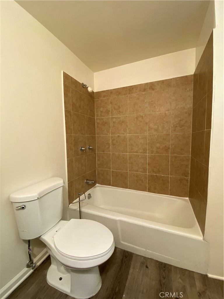 208 South Park View Street, Unit 2 Los Angeles, CA 90057 - Photo 12 of 24 a bathroom with a toilet and a bath tub