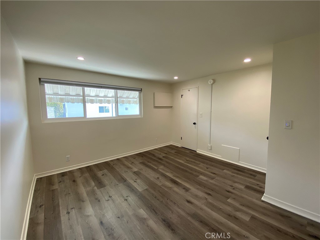 208 South Park View Street, Unit 2 Los Angeles, CA 90057 - Photo 15 of 24 an empty room with wooden floor and windows