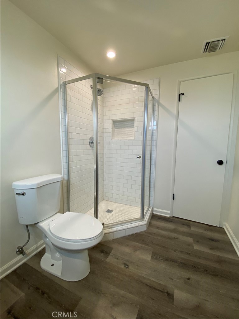 208 South Park View Street, Unit 2 Los Angeles, CA 90057 - Photo 21 of 24 a bathroom with a toilet and a shower
