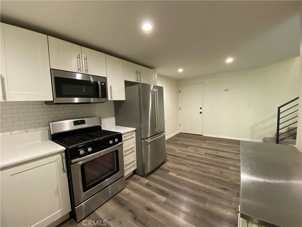208 South Park View Street, Unit 2 Los Angeles, CA 90057 - Photo 6 of 24 a kitchen with a stove and a microwave