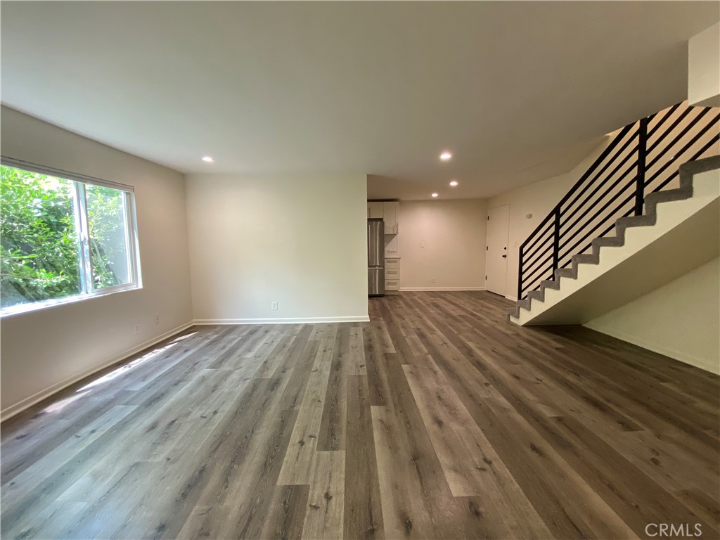 208 South Park View Street, Unit 2 Los Angeles, CA 90057 - Photo 10 of 24 wooden floor in an empty room with a window