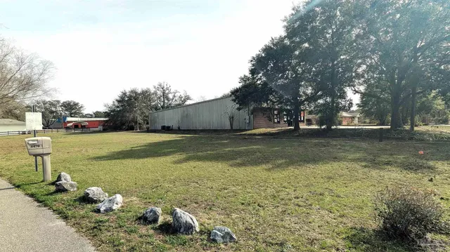 a view of a golf course with a tree