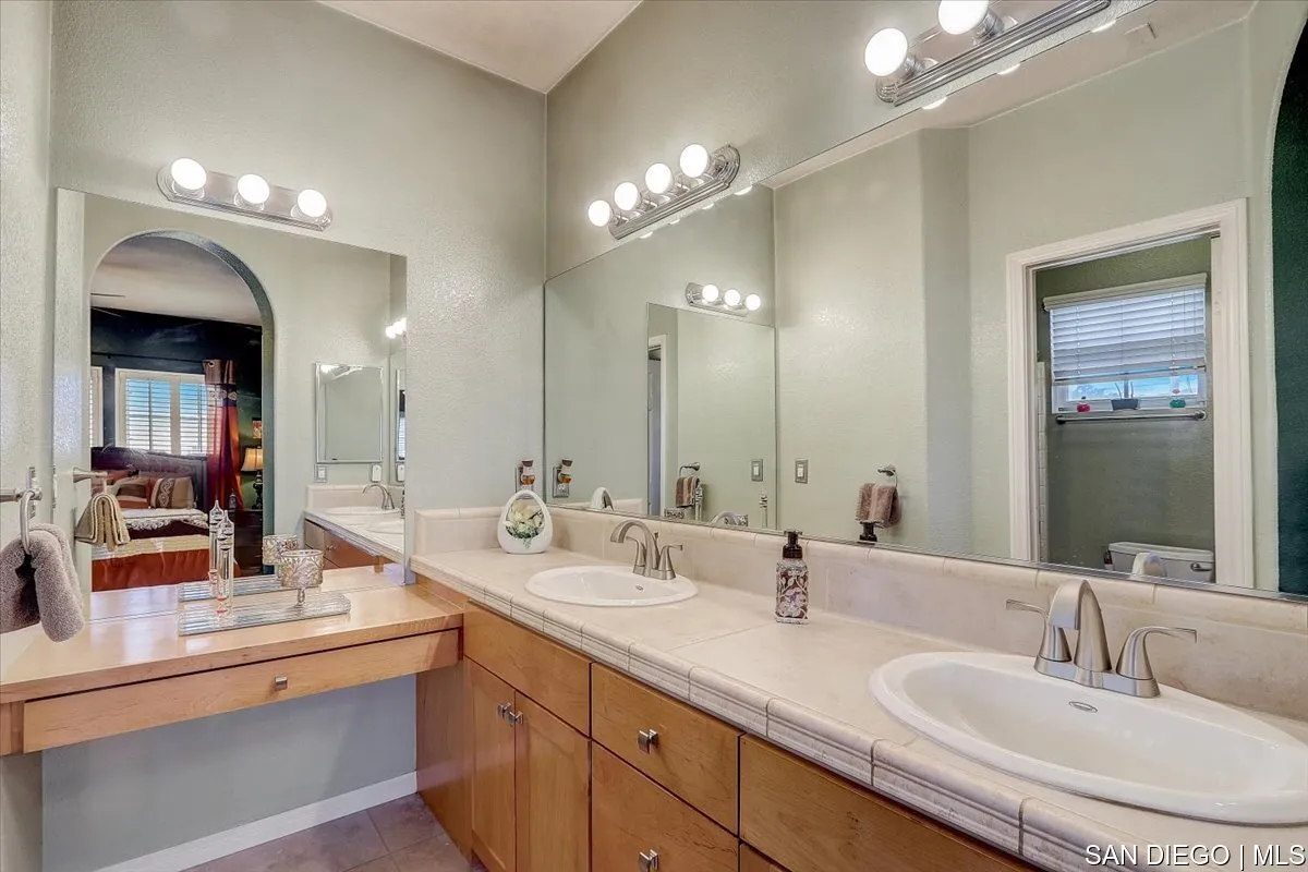 1213 Page Lane Santee, CA 92071 - Photo 13 of 21 a bathroom with double vanity and a mirror