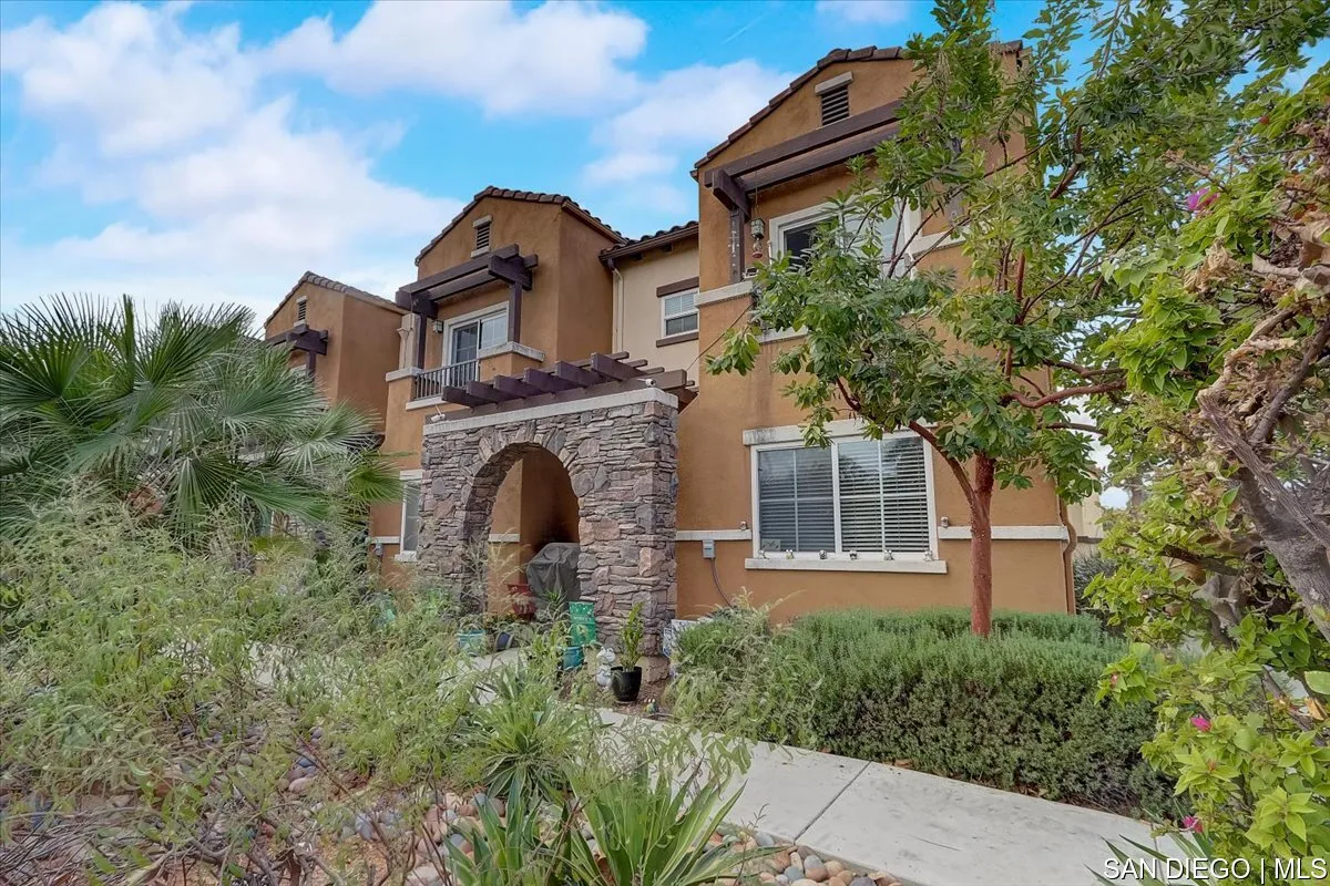 1213 Page Lane Santee, CA 92071 - Photo 2 of 21 a front view of a house with plants and garden