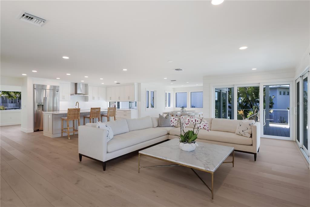 204 Waterway Avenue Boca Grande, FL 33921 - Photo 11 of 49 a living room with furniture and a view of kitchen