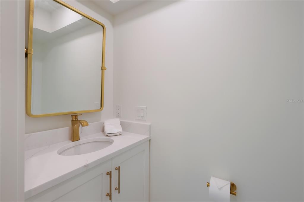 204 Waterway Avenue Boca Grande, FL 33921 - Photo 12 of 49 a bathroom with a sink and a mirror