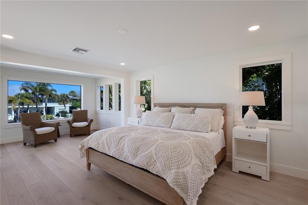 204 Waterway Avenue Boca Grande, FL 33921 - Photo 13 of 49 a bedroom with a bed and a couch