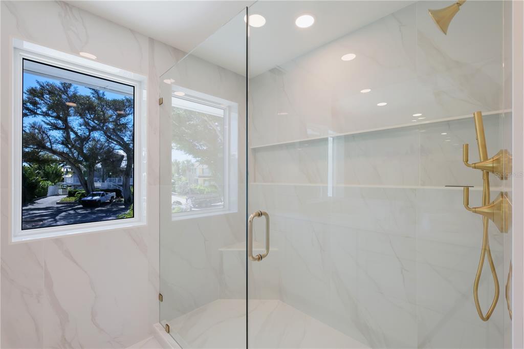 204 Waterway Avenue Boca Grande, FL 33921 - Photo 16 of 49 a bathroom with a shower