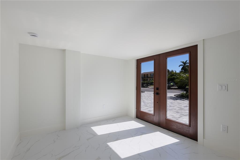 204 Waterway Avenue Boca Grande, FL 33921 - Photo 23 of 49 a view of an entryway with wooden floor