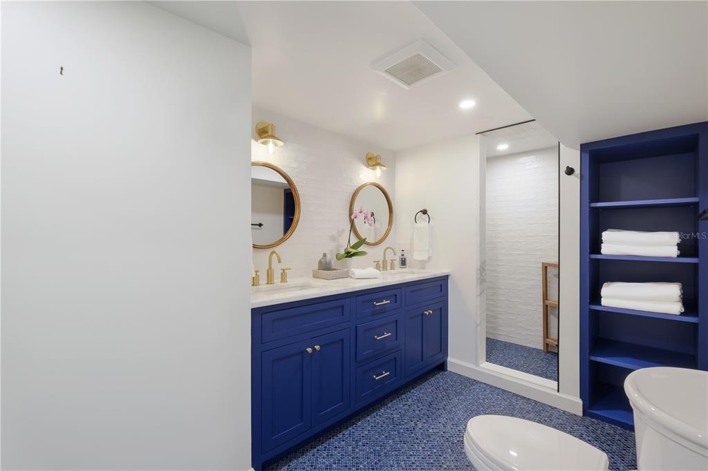 204 Waterway Avenue Boca Grande, FL 33921 - Photo 28 of 49 a bathroom with a toilet a sink and mirror