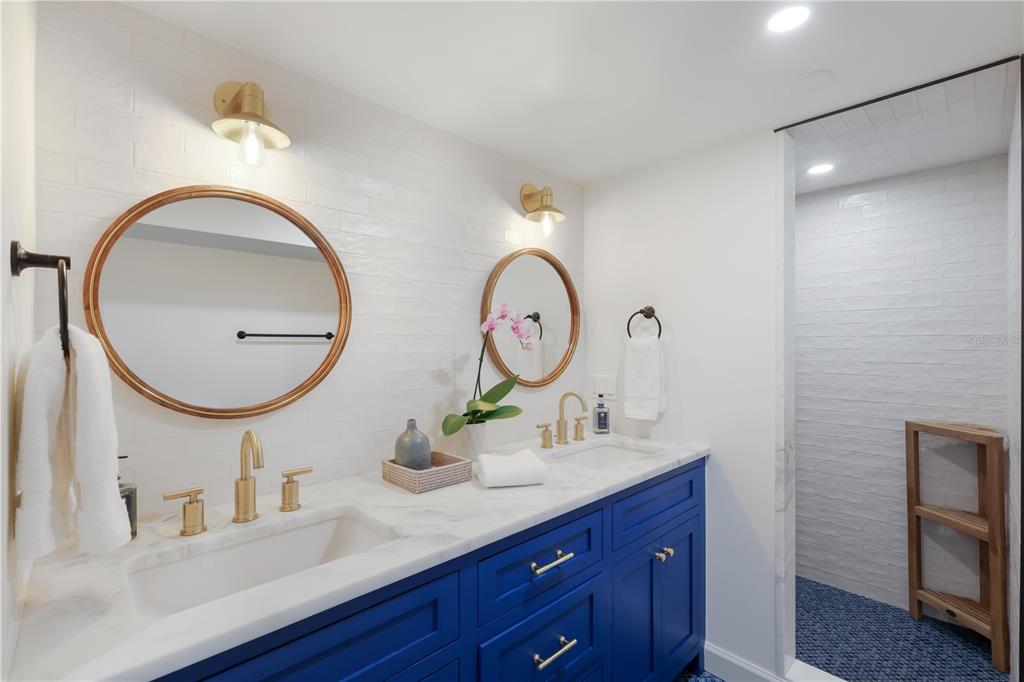 204 Waterway Avenue Boca Grande, FL 33921 - Photo 29 of 49 a bathroom with a sink and a mirror