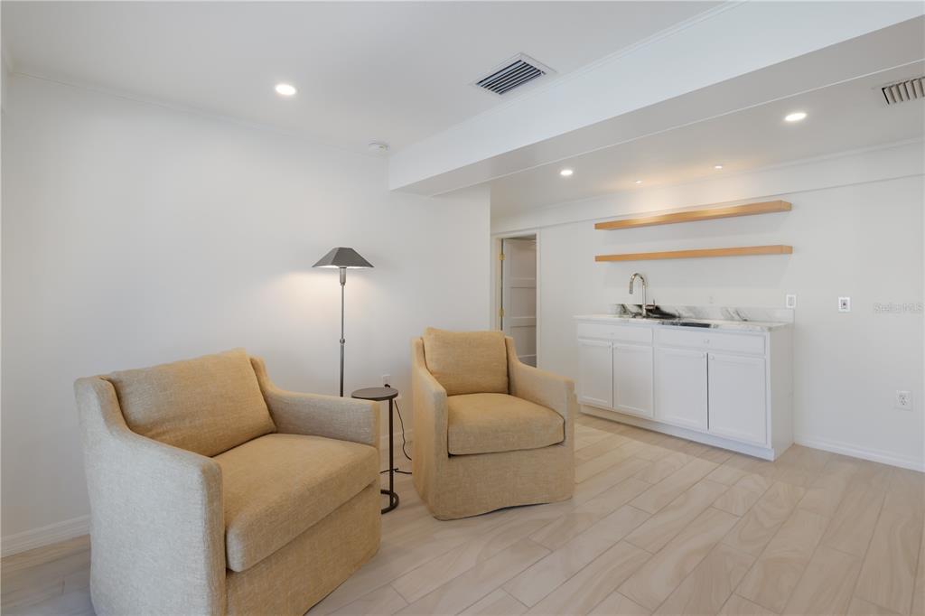 204 Waterway Avenue Boca Grande, FL 33921 - Photo 31 of 49 a living room with furniture and a wooden floor