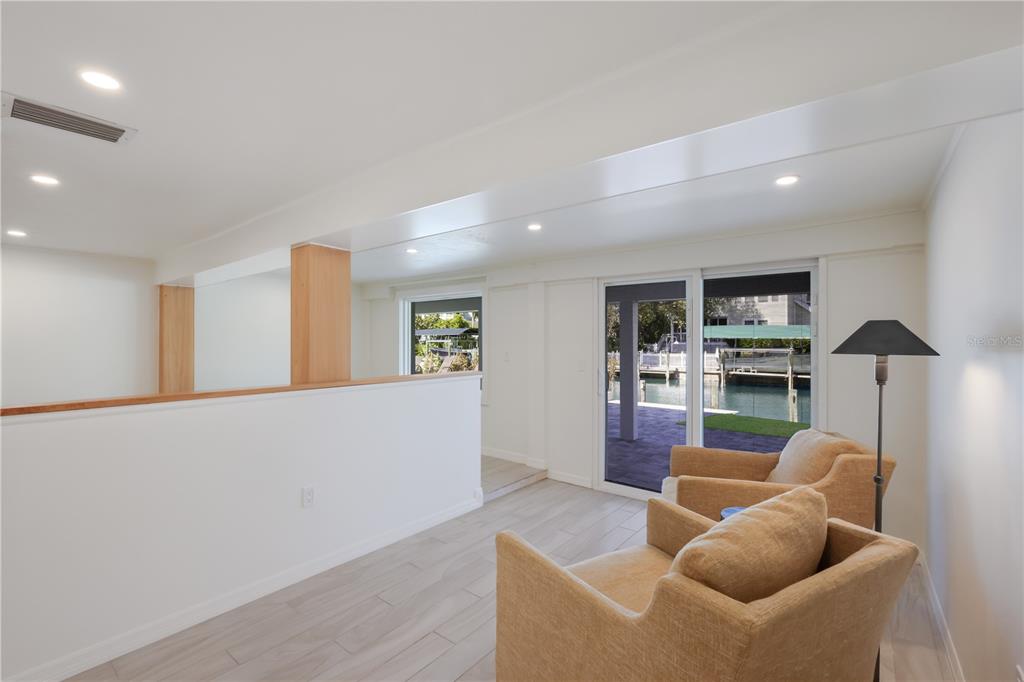 204 Waterway Avenue Boca Grande, FL 33921 - Photo 32 of 49 a living room with furniture and a flat screen tv