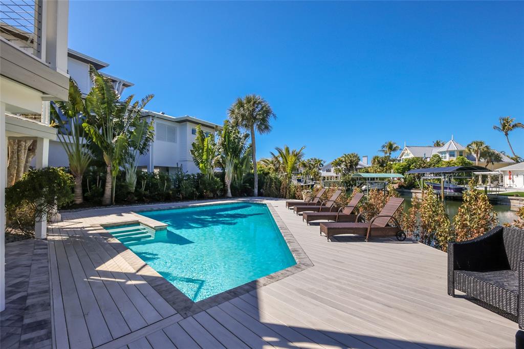 204 Waterway Avenue Boca Grande, FL 33921 - Photo 45 of 49 a view of a house with swimming pool and sitting area