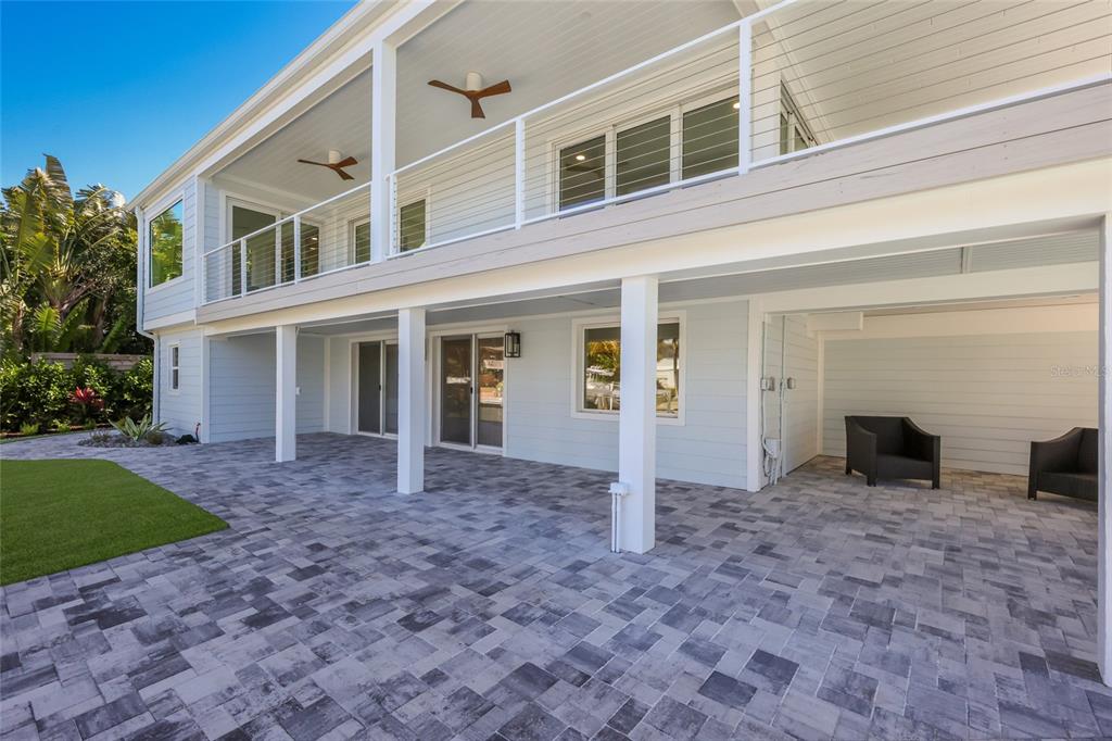 204 Waterway Avenue Boca Grande, FL 33921 - Photo 46 of 49 a view of an house with backyard porch and garden