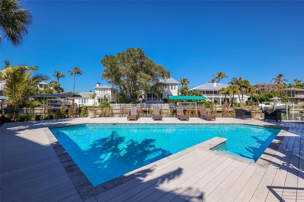204 Waterway Avenue Boca Grande, FL 33921 - Photo 47 of 49 a view of a swimming pool and outdoor seating