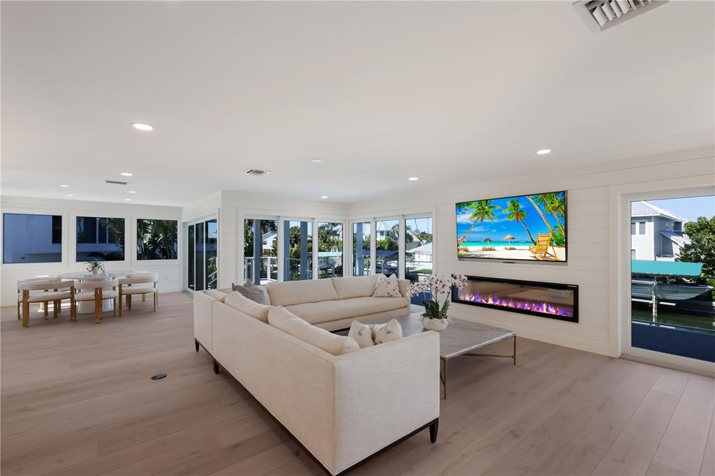 204 Waterway Avenue Boca Grande, FL 33921 - Photo 9 of 49 a living room with furniture and a flat screen tv