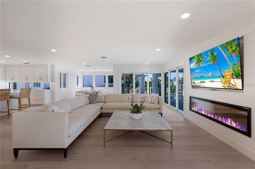 204 Waterway Avenue Boca Grande, FL 33921 - Photo 10 of 49 a living room with furniture and a flat screen tv