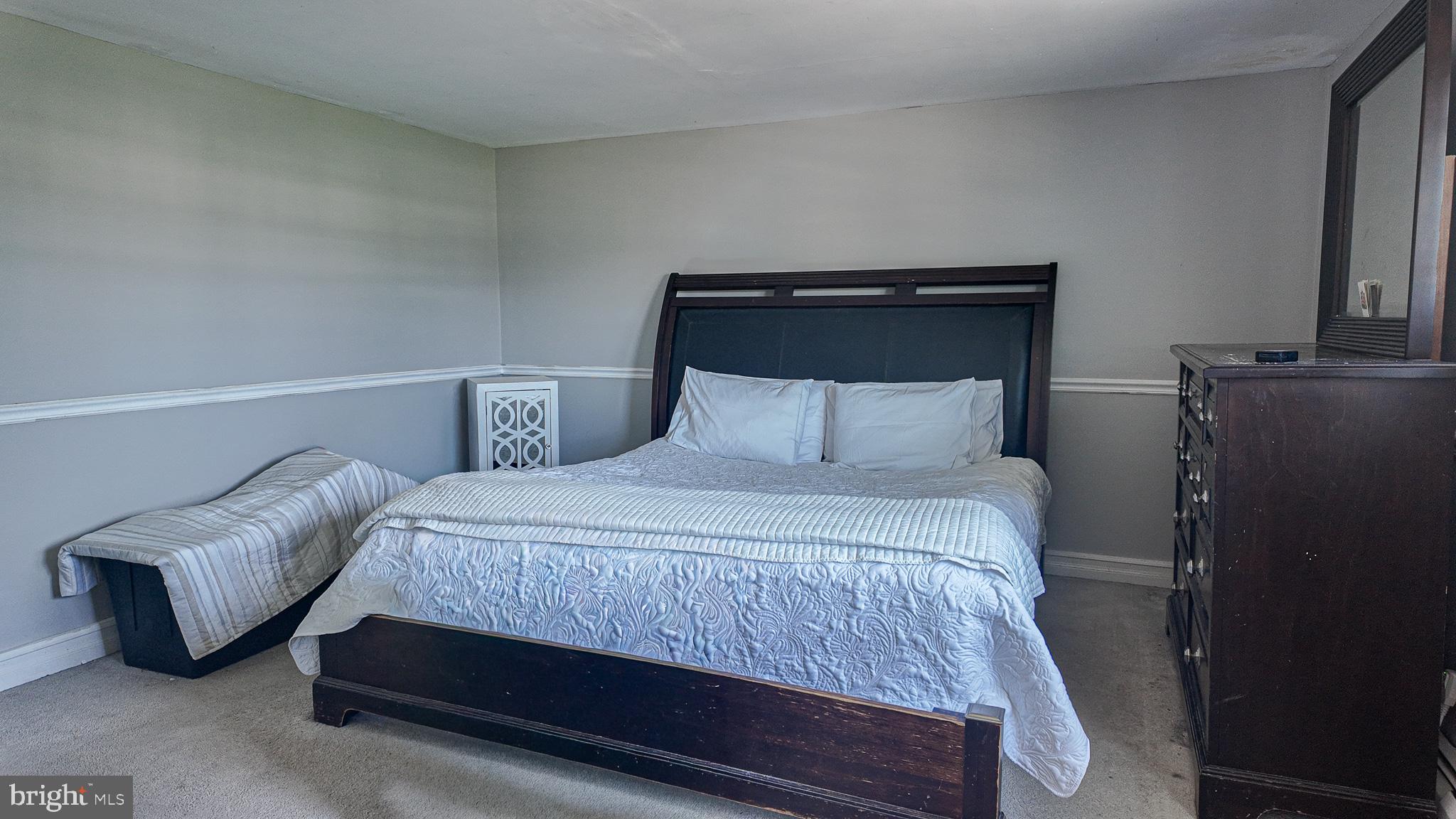 3503 Brookview Road Philadelphia, PA 19154 - Photo 14 of 30 a bedroom with a bed and a mirror