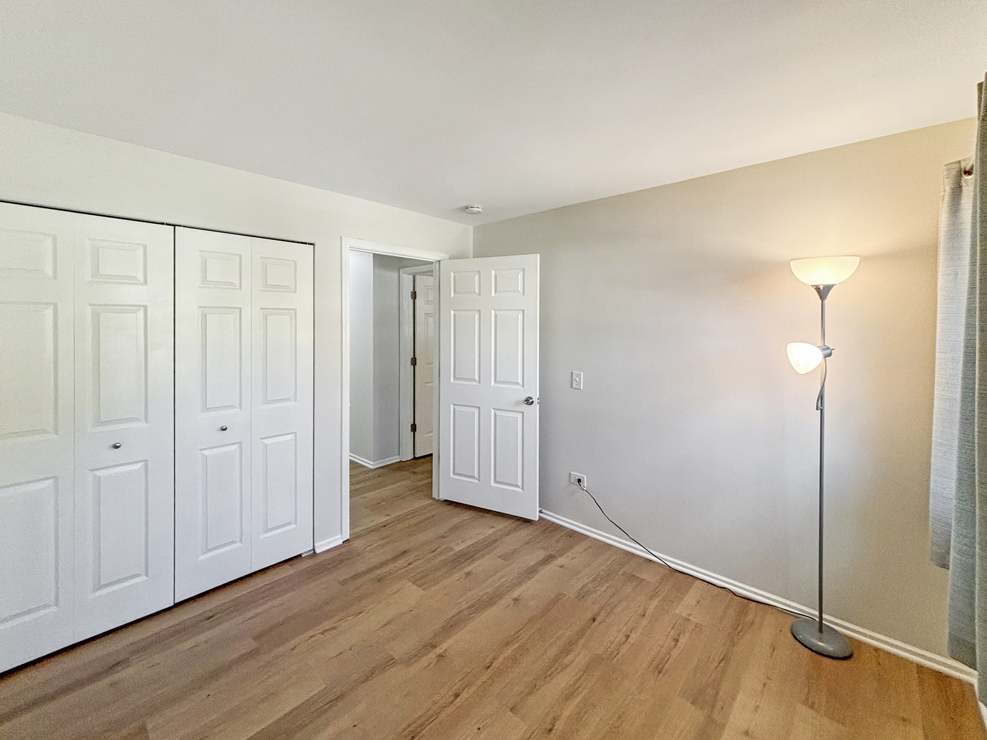 71 Larch Court, Unit B Schaumburg, IL 60193 - Photo 11 of 14 an empty room with wooden floor