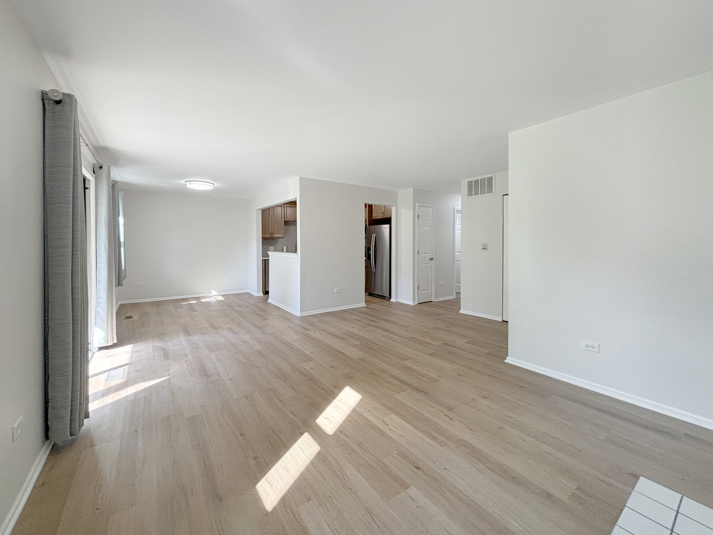 71 Larch Court, Unit B Schaumburg, IL 60193 - Photo 3 of 14 a view of empty room with wooden floor