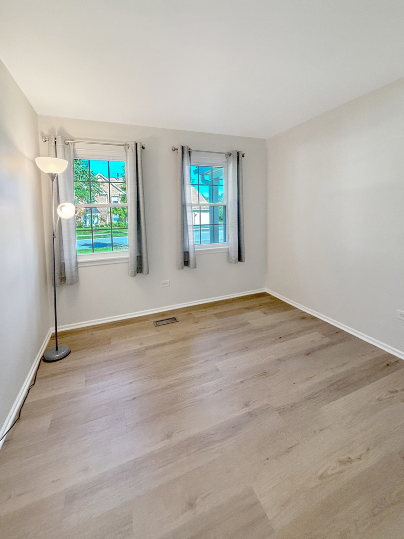 71 Larch Court, Unit B Schaumburg, IL 60193 - Photo 10 of 14 a view of an empty room with a window