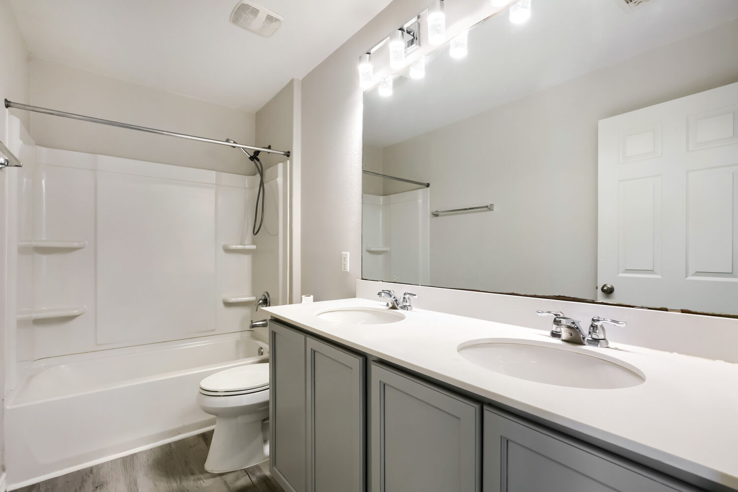 153 Marcheeta Way Leander, TX 78641 - Photo 15 of 17 A spacious double vanity and a clean tub combination highlight this updated bathroom.