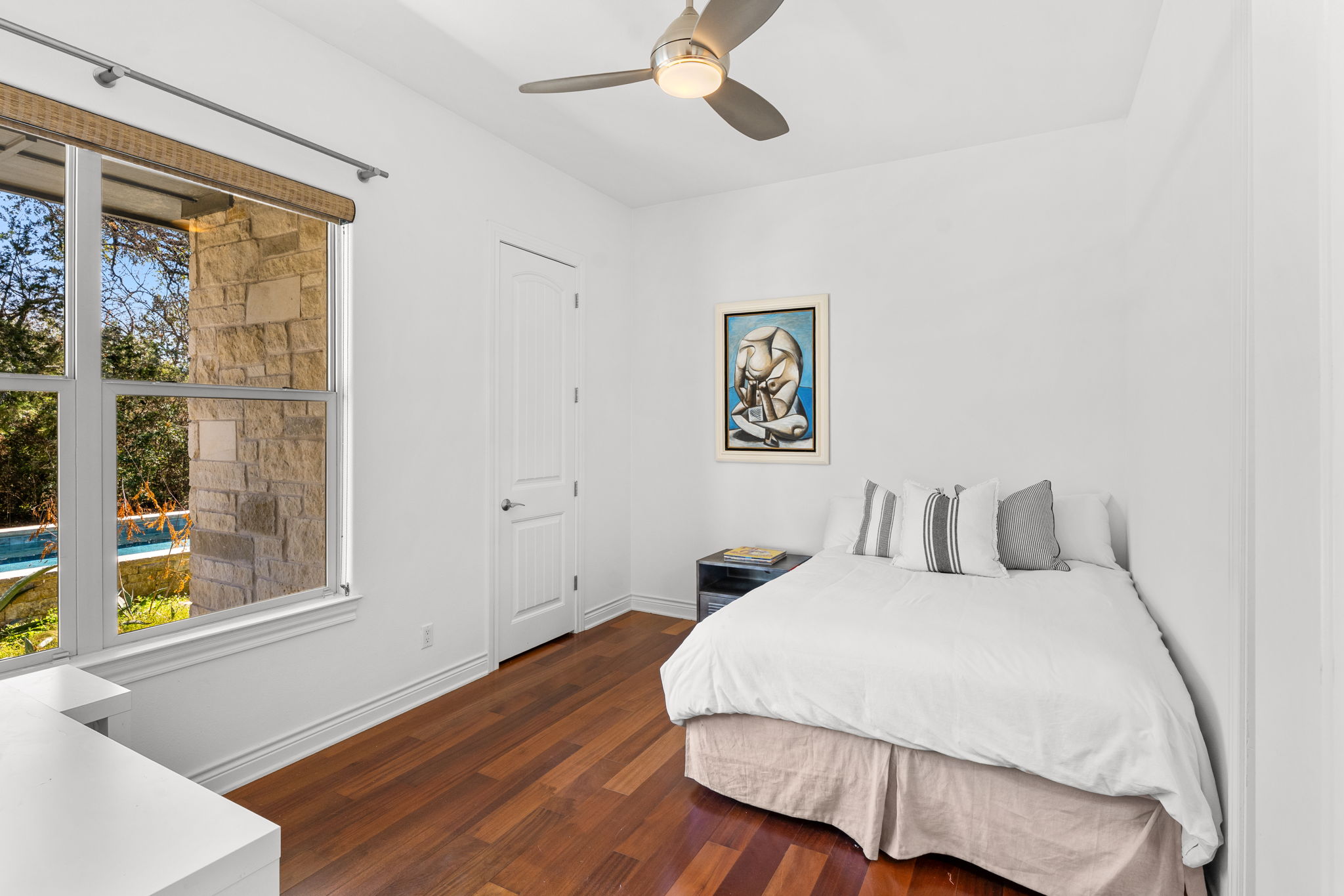 9514 San Lucas Road Austin, TX 78737 - Photo 28 of 38 a bedroom with a bed and a window