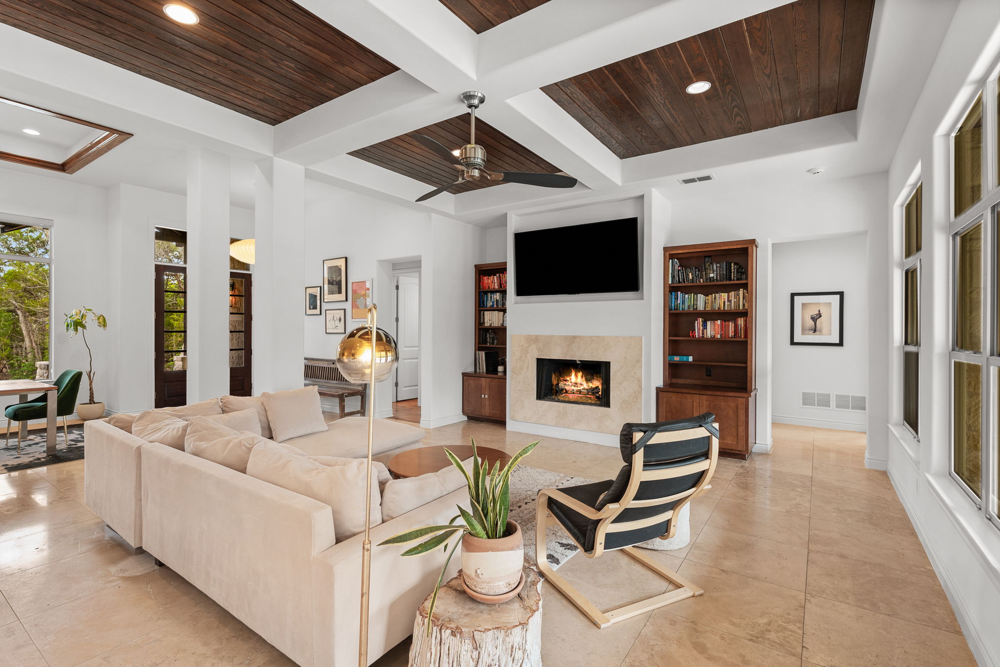 9514 San Lucas Road Austin, TX 78737 - Photo 4 of 38 a living room with furniture a fireplace and a flat screen tv
