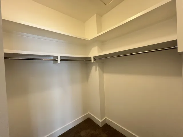 a view of a room with shelf on the wall