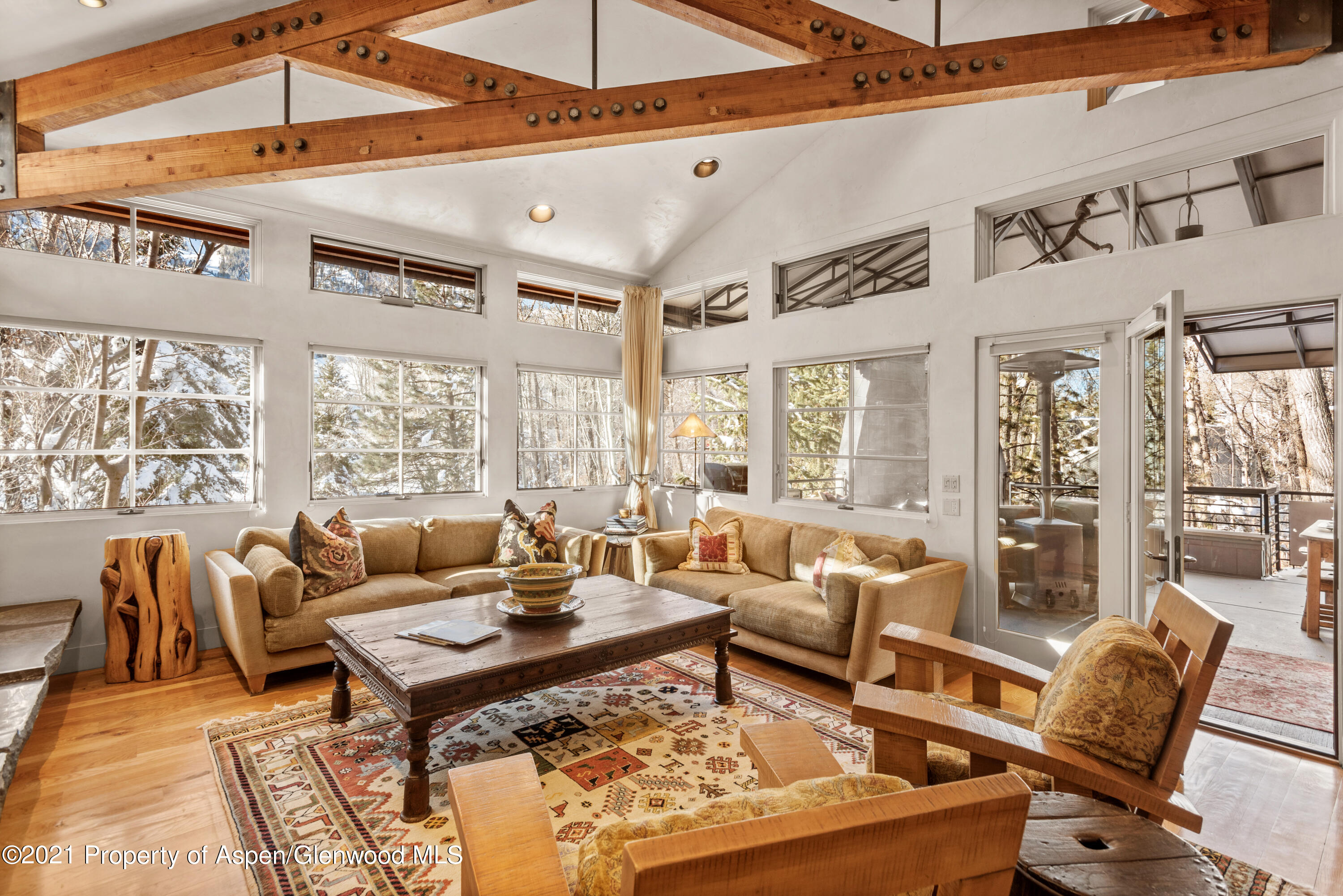 111 Neale Avenue Aspen, CO 81611 - Photo 2 of 30 a living room with furniture a rug and a large window