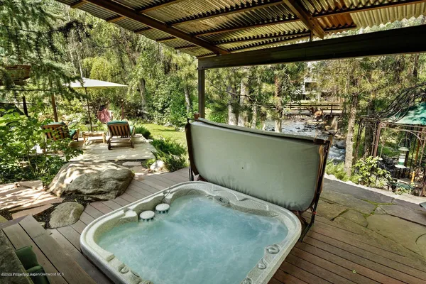 a view of a balcony with chair and table