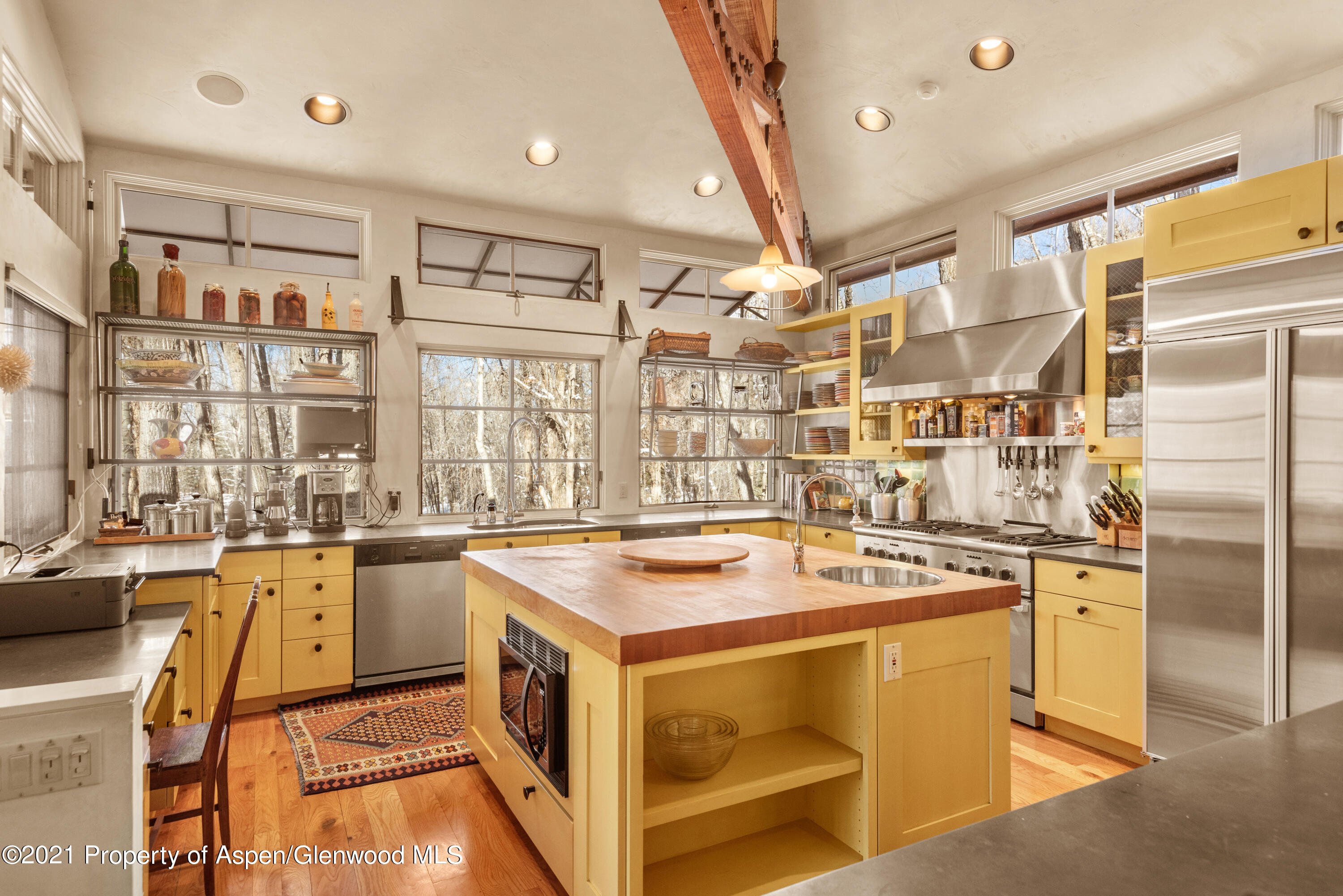 111 Neale Avenue Aspen, CO 81611 - Photo 5 of 30 a kitchen that has a sink and a stove in it
