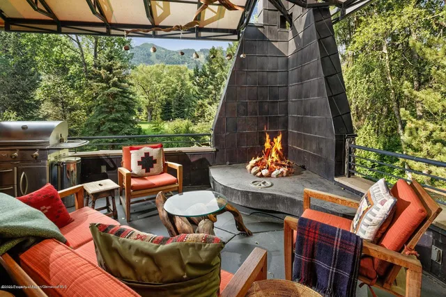 a backyard of a house with outdoor seating
